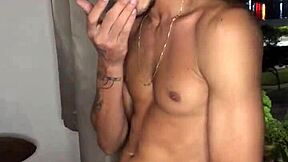 Naughty boy jerks off at the building window with tattoos