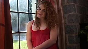 The lesbian couple, eyes filled with love, starts with kissing and explores with strapon