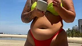 casada drawing eyes at the beach, flashing in a tight bikini with style
