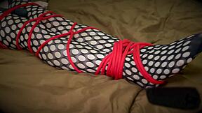 Tied girl cums from a vibrator. Is she enjoying the bondage?