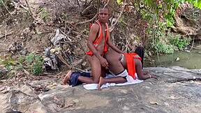 Worshiping a huge fat ass outdoors. Homemade action with big tits bouncing in the open air.