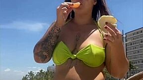 casada drawing eyes at the beach, flashing in a tight bikini with style