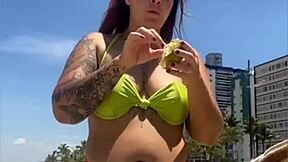 casada drawing eyes at the beach, flashing in a tight bikini with style