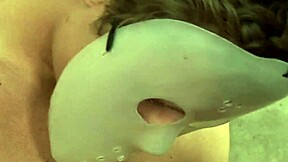 Nataly Dangelo indulges in perverted games with three masked men on the bed.