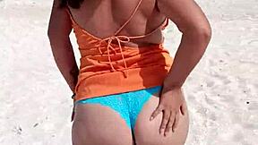 mexican puta flashing thong and tits on public beach