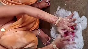 Hey, watch this beautiful Indian village bhabhi pissing and bathing outdoors