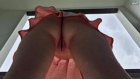 Upskirt hidden camera catches shaved pussy without panties in mall