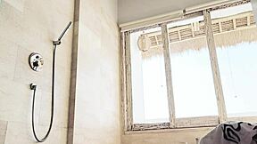 Asian girl washes clothes in shower