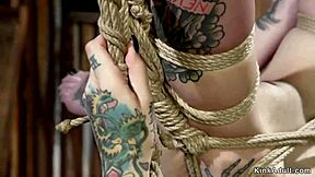 Tied up alternative lesbian gets her ass whipped in intense BDSM session