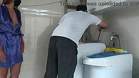 Housewife teases the repair tech fixing her washing machine with flirty moves