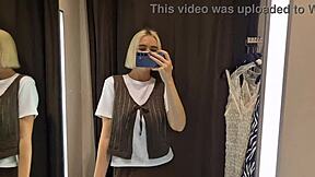 Watch me strip naked in mall fitting room trying sexy clothes. My big tits steal the show!