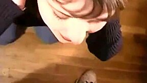 A brunette milf gets a facial from a big dick.