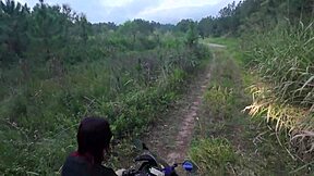 In the public woods, a redhead Latina amateur exposes her big tits for voyeurs