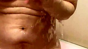 married woman 38 years old with beautiful nipples dripping with water in the bathroom