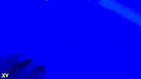 suggestive blacklight fetish with feet, toes, and footjob in dark setting.