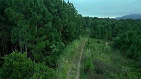 In the public woods, a redhead Latina amateur exposes her big tits for voyeurs