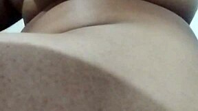 Latina brunette stretches big ass while masturbating.