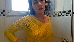 Horny latina girl masturbates in the bath, rubbing her breasts and showing her ass without panties.