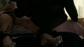 double domme session with bound participant in fetish play