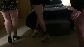 double domme session with bound participant in fetish play