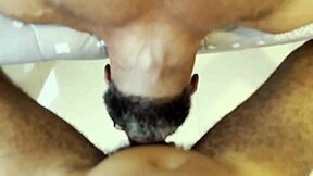 tattooed bodybuilder chats with muscular guy in casual setting.