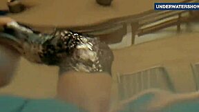 I flash my bright tits underwater in the pool, making everyone horny