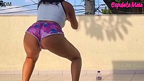 Curvy brunette trains outdoors, shorts tucked up her fat ass teasingly.