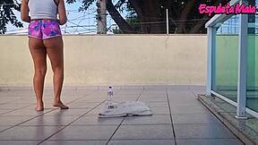 Curvy brunette trains outdoors, shorts tucked up her fat ass teasingly.