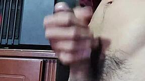 Young Latina amateur slaps her hard cock for a big cumshot solo