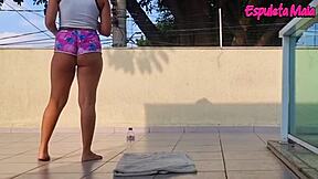 Curvy brunette trains outdoors, shorts tucked up her fat ass teasingly.