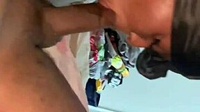 Ebony woman sucking on a black man's wet member