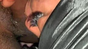 Ebony woman sucking on a black man's wet member