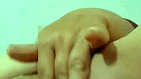 Mature Colombian housewife suggestively uses a carrot in her bedroom