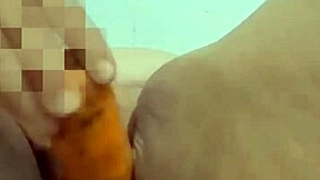 Mature Colombian housewife suggestively uses a carrot in her bedroom