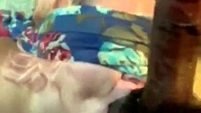 She's blindfolded and getting a sloppy face fuck from that monster cock.