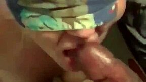 She's blindfolded and getting a sloppy face fuck from that monster cock.
