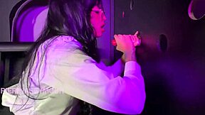 Beautiful brunette with big ass and long hair gets two dicks in glory hole