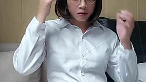 Shemale Ting Xuan in stockings and heels gives cumshot at office.