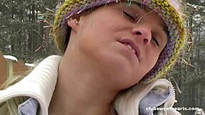 naked woman fingers her tight shaved pussy with toys in the snow intensely