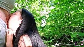 Watch this young brunette cocksucker make a fat cock cum in the forest
