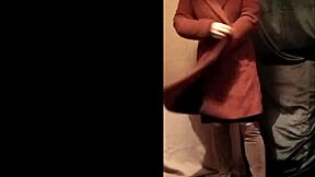 french housewife self-bonds in leather harness for outdoor exhibition