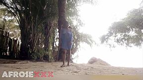 Black girl teasing on the beach with homemade vibes