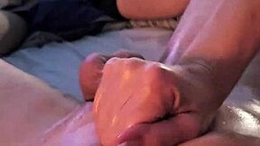 oiled couple's horny handjob session.
