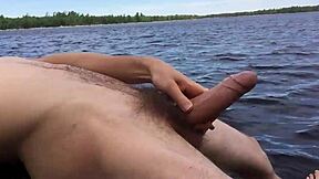 boyfriend shows off by the lake on trail