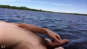 boyfriend shows off by the lake on trail