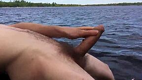 boyfriend shows off by the lake on trail