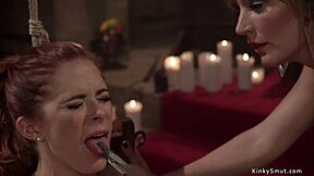 busty woman experiences whipping and bondage in a session with another woman