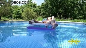 I'm wet and horny in the pool flashing my natural tits, oops!