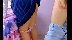 horny students fuck in the living room with family around.