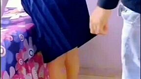 horny students fuck in the living room with family around.